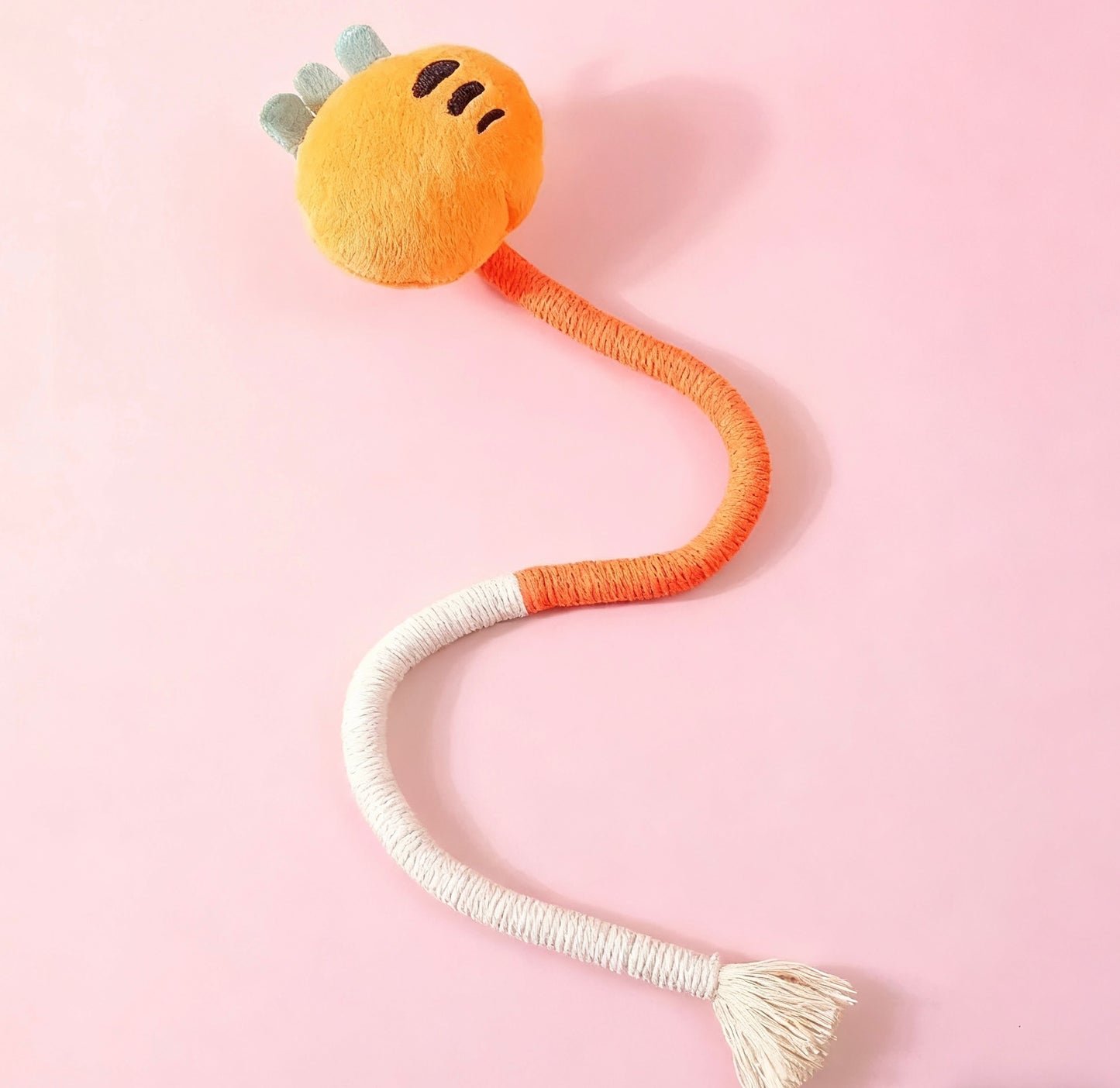 AA:A doll rope with a cat biting