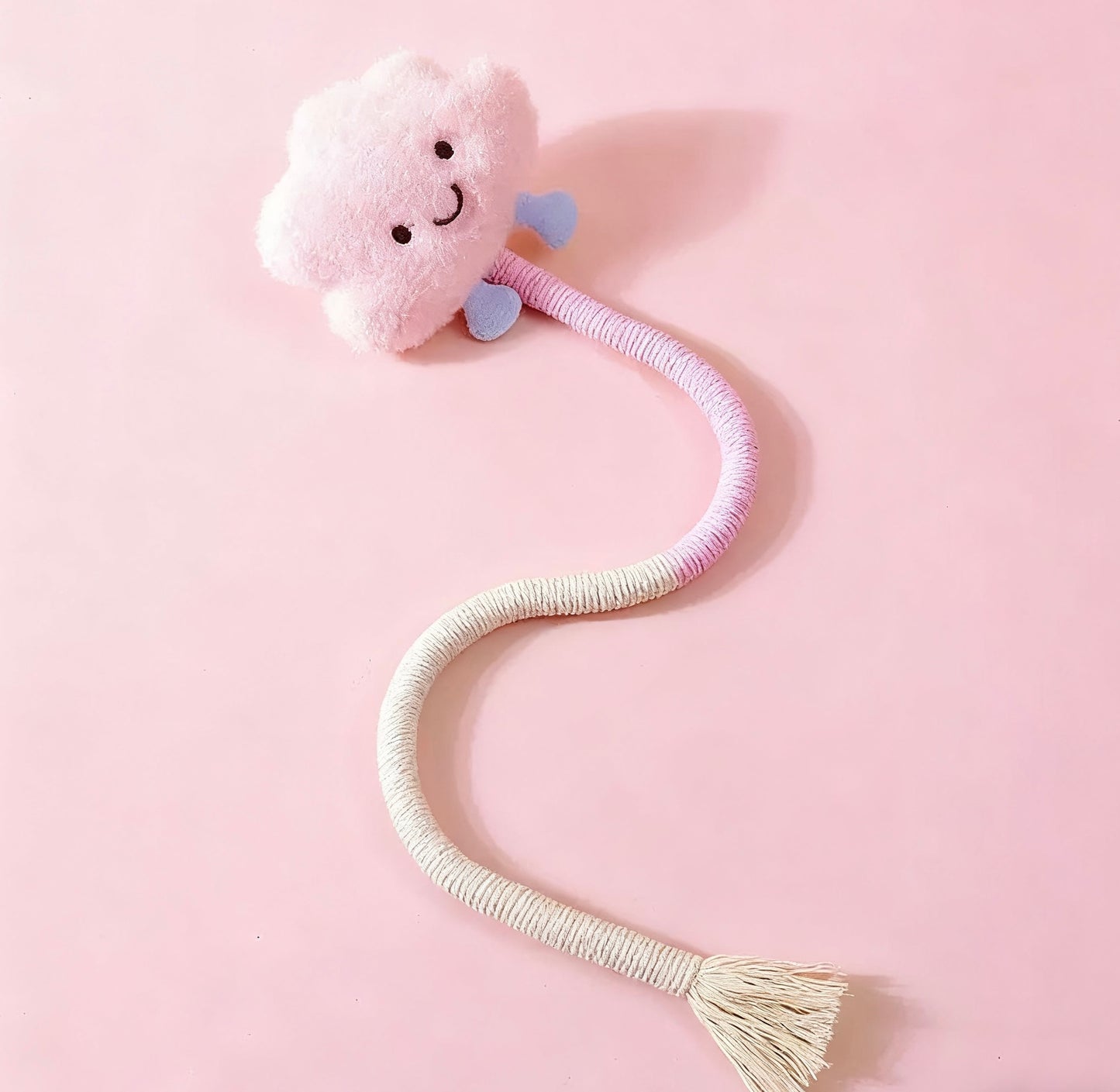 AA:A doll rope with a cat biting