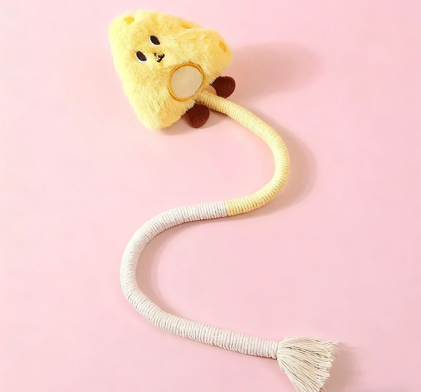 AA:A doll rope with a cat biting