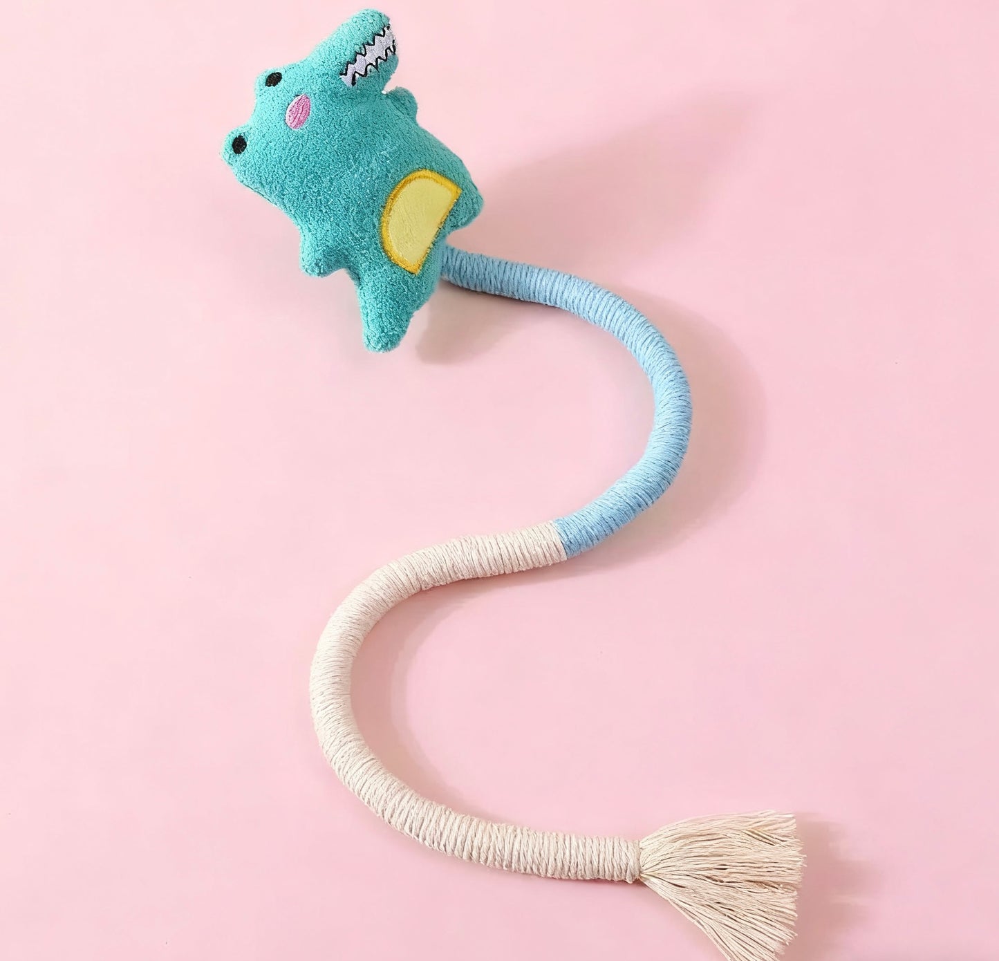 AA:A doll rope with a cat biting